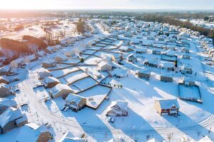 Aerial view of small town covered in snow