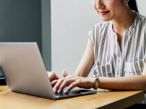 female real estate lawyer working on laptop